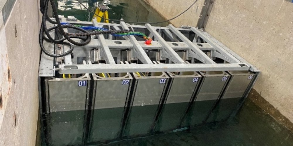 a wavemaker installed in a concrete trench of water